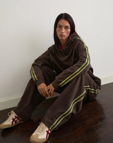 Oze Trackpant in Bitter Chocolate with Green Binding and M Embroidery
